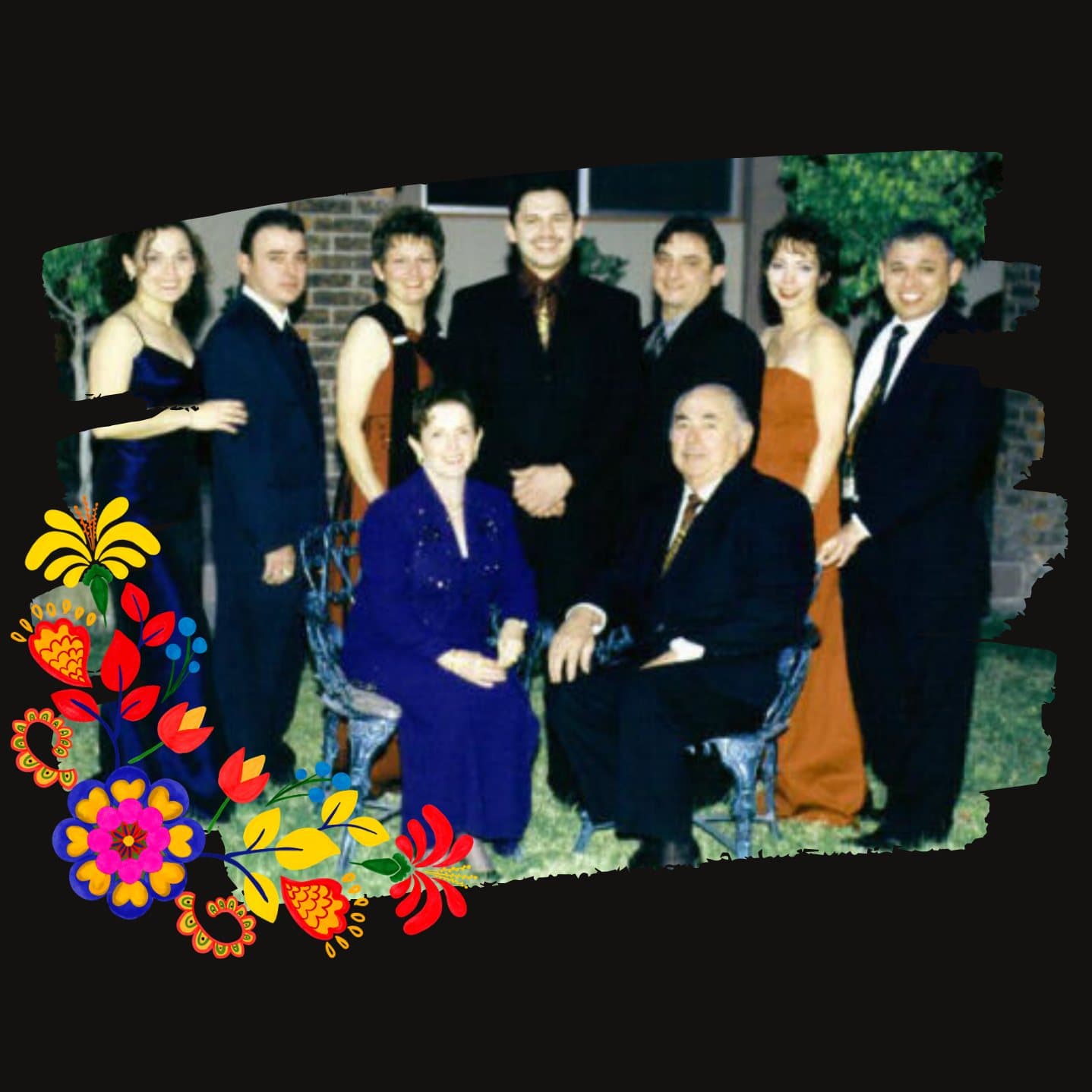 The Alvarado family, founders of Mexican Fiesta, dressed up for a family portrait outdoors — an older couple seated in front with seven family members standing behind them